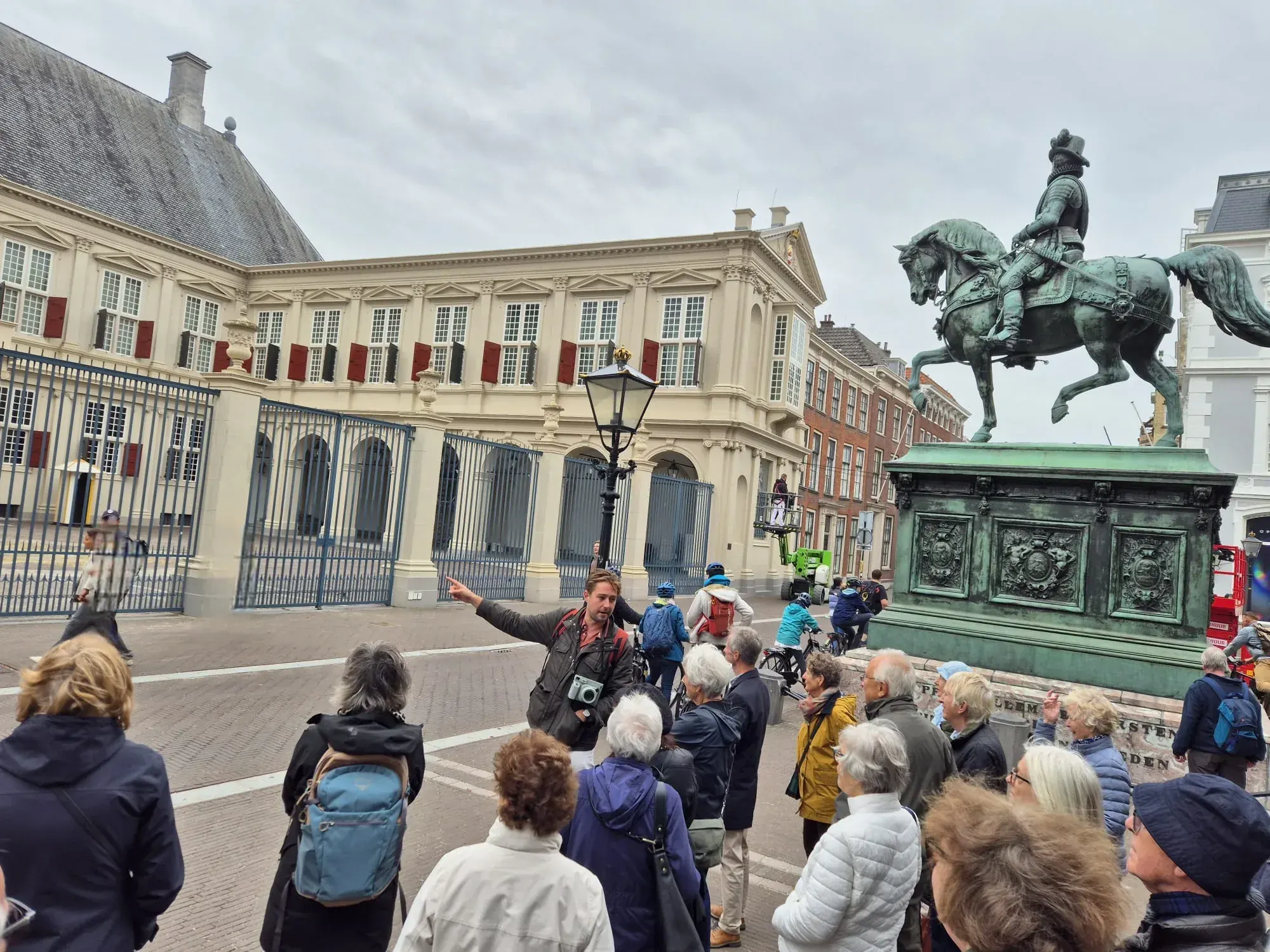 A guide showing a private group Noordeinde Palace, the king’s working palace in The Hague