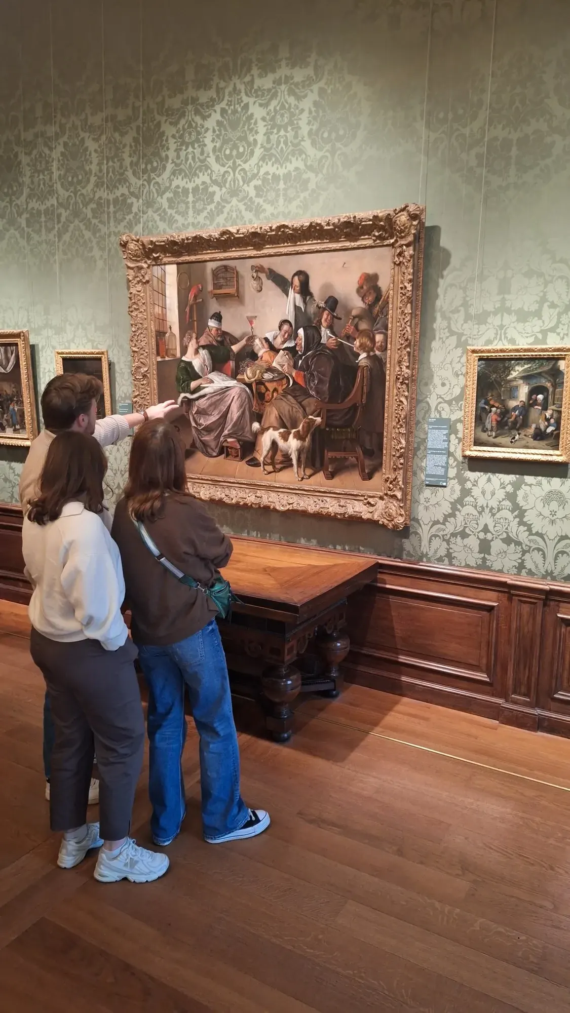 Een groep voor een groot huishoudtafereel van Jan Steen, Mauritshuis, Den Haag